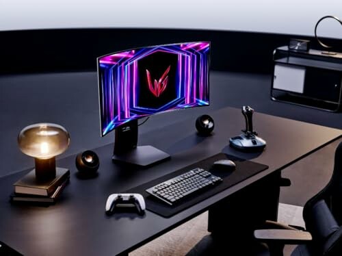 Modern gaming setup with a curved monitor, joystick, and gaming controller on a sleek desk.